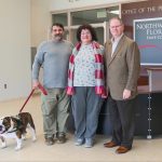 (L to R): Thor, Jeff Claudio’s service dog; Jeff Claudio; Leonora Claudio; NWFSC President, Dr. Devin Stephenson.