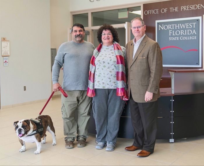 (L to R): Thor, Jeff Claudio’s service dog; Jeff Claudio; Leonora Claudio; NWFSC President, Dr. Devin Stephenson.