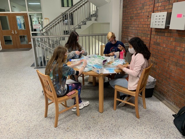 Northwest Florida State College Phi Theta Kappa students assemble safety kits for students at the beginning of the spring semester.